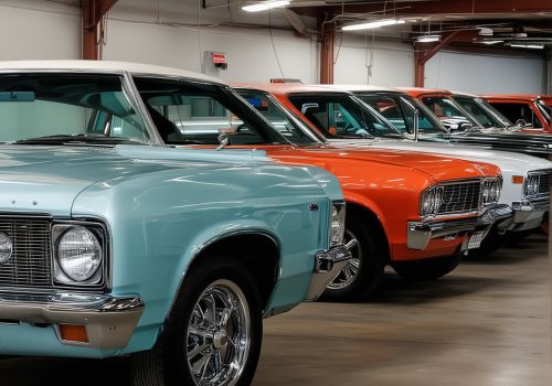 Multiple restored and custom painted vehicles in professional auto shop showing quality of work
