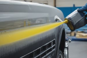 Classic car restoration project with original paint matching